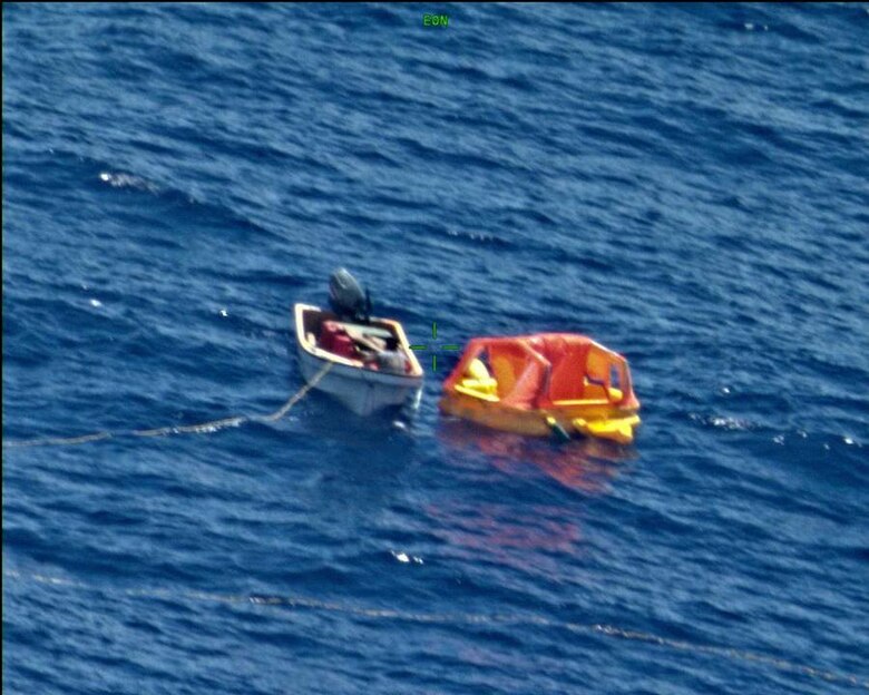 CHUUK ATOLL, Federated States of Micronesia (Feb. 20, 2018) Mariners maneuver a UNI-PAC II Search and Rescue (SAR) kit closer to their vessel. The SAR kit was deployed from a P8-A Poseidon aircraft assigned to the "Fighting Tigers" of VP-8, and its use during the rescue of three fishermen in the South Pacific marked the first time it had successfully been deployed in a real world SAR operation.