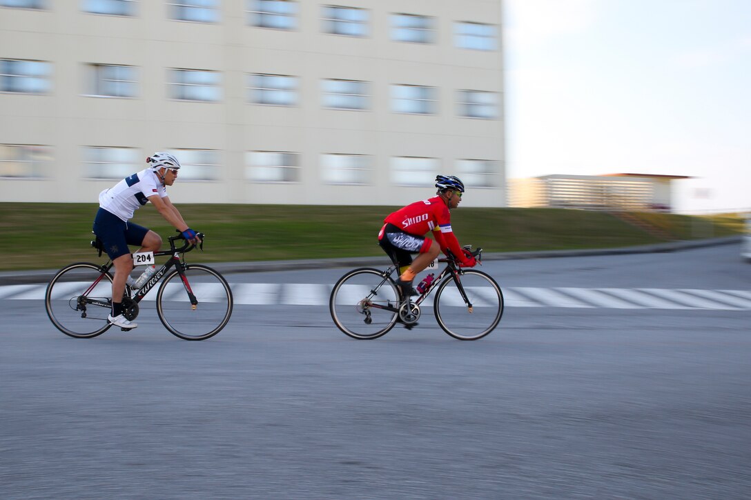 Racers compete in a bike race Feb. 18 aboard Camp Kinser, Okinawa, Japan. The race brought U.S. and local communities across Okinawa together to take part in friendly competition. About 130 racers from across the island participated in the event. (U.S. Marine Corps photo by Pfc. Nicole Rogge)