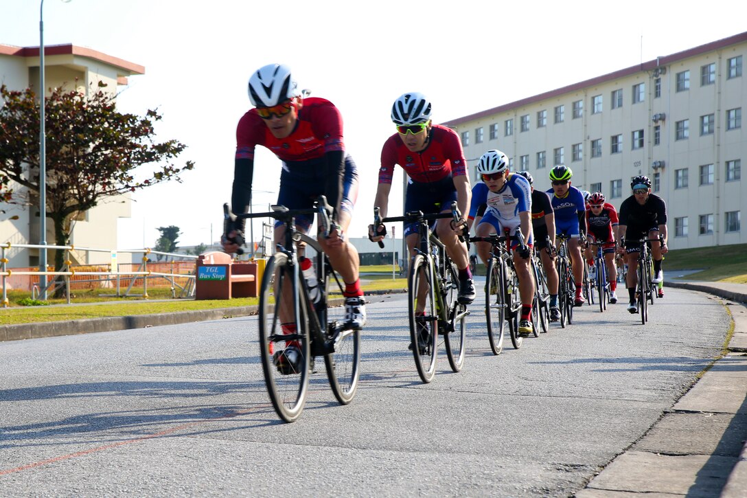 Racers peddle down a hill during a bike race Feb. 18 aboard Camp Kinser, Okinawa, Japan. The race brought U.S. and local communities across Okinawa together to take part in friendly competition. About 130 racers joined together for the event. (U.S. Marine Corps photo by Pfc. Nicole Rogge)