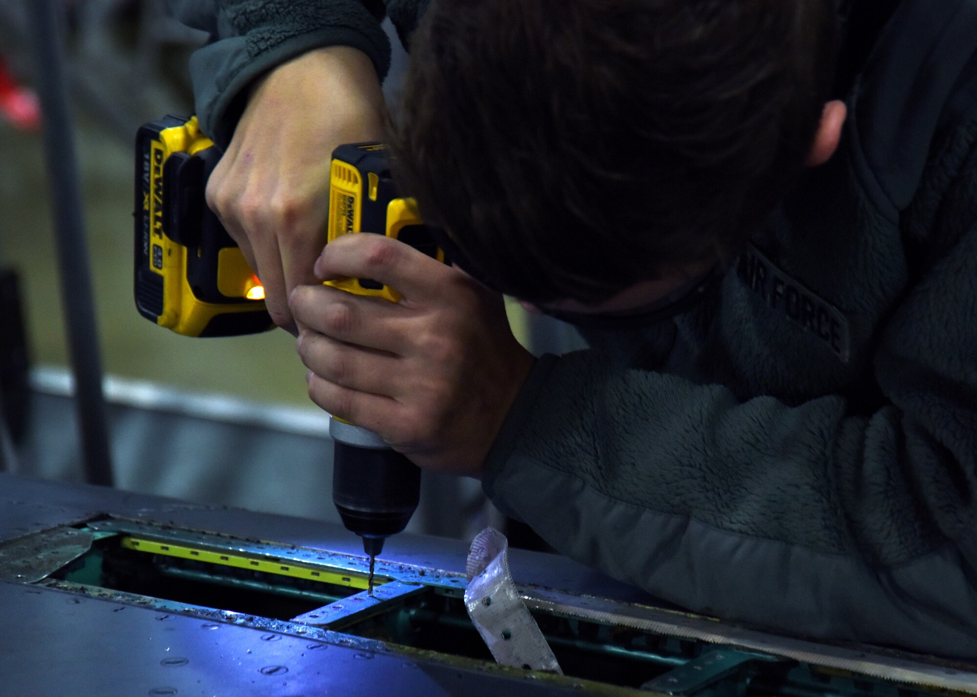 Airman 1st Class Nathan Jones, 48th Equipment Maintenance Squadron sheet metal technician, works on an F-15 E Strike Eagle during a phase inspection at Royal Air Force Lakenheath, England, Feb. 14. During the inspection, crew chiefs inspect the different parts of the aircraft and repair any issues they find. (U.S. Air Force photo/Senior Airman Abby L. Finkel)