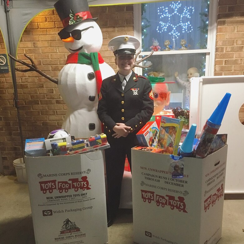 One of Cpl. Kayla Soles' favorite volunteer jobs is helping with the Marine Corps Toys for Tots program.  Here she is collecting toys at the Glancy Light Show on Christmas Eve.