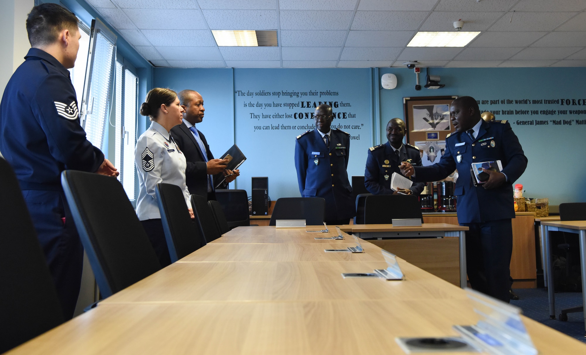 U.S. Air Force Chief Master Sgt. Kathi Glascock, U.S. Air Forces in Europe Kisling Noncommissioned Officer Academy commandant, discusses the Airman Leadership School program with Lt. Col. Aliou Faye, Senegal Air Force chief of the Human Resources Division, about how ALS promotes a learning environment and open discussion at the Kisling NCOA on Kapaun Air Station, Germany, Feb. 16, 2018. On average, 595 students complete ALS on Vogelweh Military Complex every year.