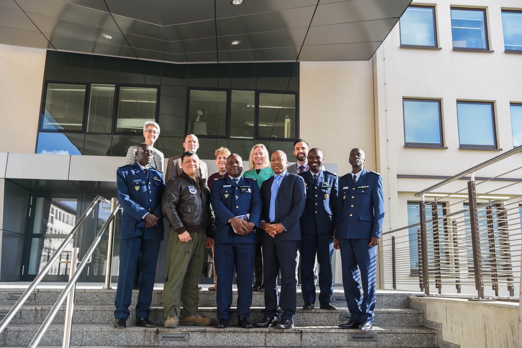 U.S. Air Force Col. Ric Trimillos, U.S. Air Forces in Europe and Africa International Affairs Division chief, and Department of Defense civilians pose with the official party from the Senegal Air Force on Ramstein Air Base, Germany, Feb. 16, 2018. The official party consists of Col. Alimbaye Manga, Senegal Air Force Chief of Staff flight safety advisor, Lt. Col. Aliou Faye, Human Resources Division chief, Maj. Mamadou Wathie, Logistics Division chief, and Capt. Momar Ndiaye, Dakar Operational Center chief and transport pilot.