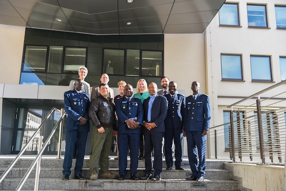 U.S. Air Force Col. Ric Trimillos, U.S. Air Forces in Europe and Africa International Affairs Division chief, and Department of Defense civilians pose with the official party from the Senegal Air Force on Ramstein Air Base, Germany, Feb. 16, 2018. The official party consists of Col. Alimbaye Manga, Senegal Air Force Chief of Staff flight safety advisor, Lt. Col. Aliou Faye, Human Resources Division chief, Maj. Mamadou Wathie, Logistics Division chief, and Capt. Momar Ndiaye, Dakar Operational Center chief and transport pilot.