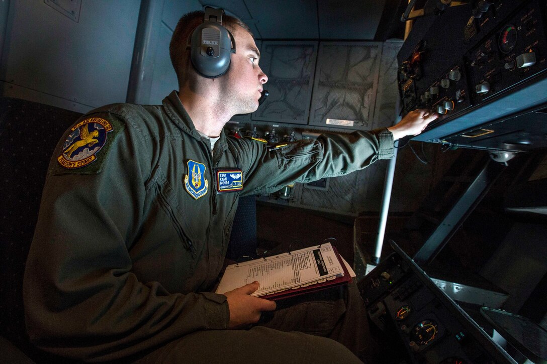 Air Force Staff Sgt. Ryan L. Woods prepares to refuel a B-52H Stratofortress.