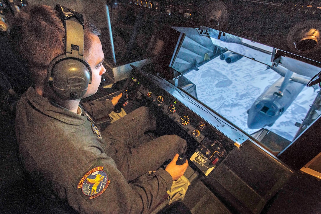 Air Force Staff Sgt. Ryan L. Woods watches as he refuels a B-52H Stratofortress over Canada Feb. 15, 2018. Woods is a boom operator assigned to the 76th Air Refueling Squadron, 514th Air Mobility Wing. Air Force photo by Master Sgt. Mark C. Olsen