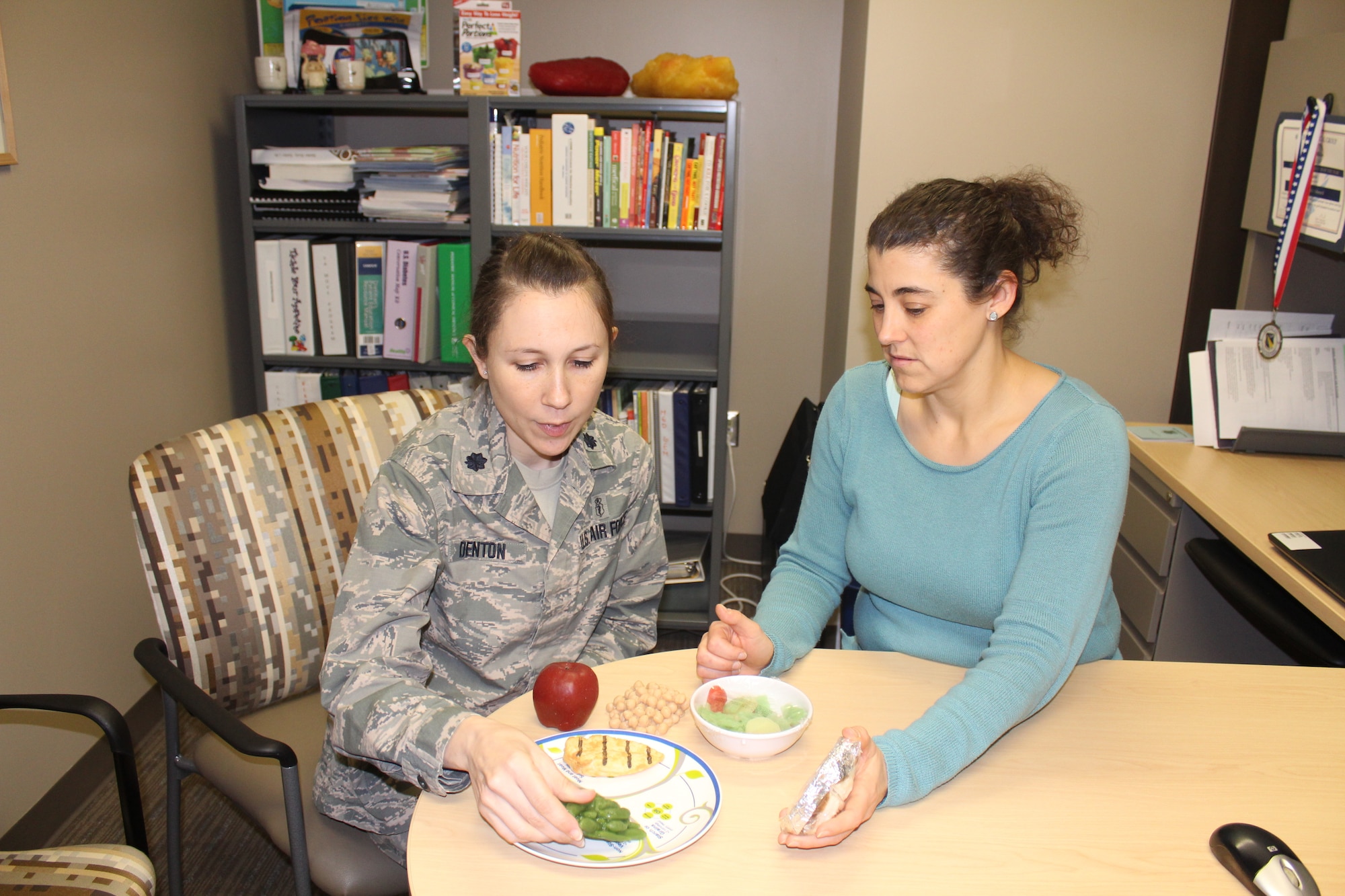 Lt. Col. Amanda Denton, Nutritional Medicine Flight commander and AFMC nutrition consultant, and Kendra Schmuck nutrition clinic manager, can help patients achieve their personal nutrition goals for a healthier lifestyle. The 88th Medical Group nutrition clinic provides medical nutritional therapy for active duty members, retirees and their dependents offering classes and individual appointments to provide nutritional guidance. (U.S. Air Force Photo/Stacey Geiger)