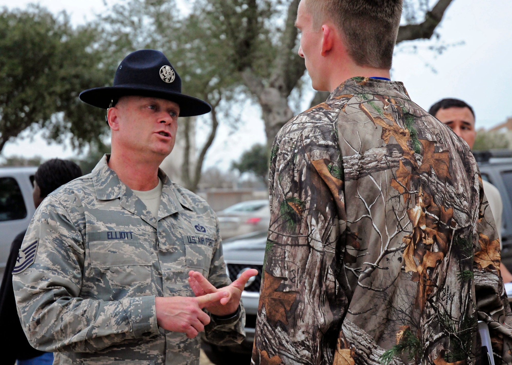 Tech. Sgt. Robert Elliott, a military training instructor and MTI recruiter visiting from the 433rd Training Squadron, Joint Base San Antonio,Texas, corrects a recruit assigned to the 919th Special Operations Wing’s Development and Training Flight at Duke Field, Fla.