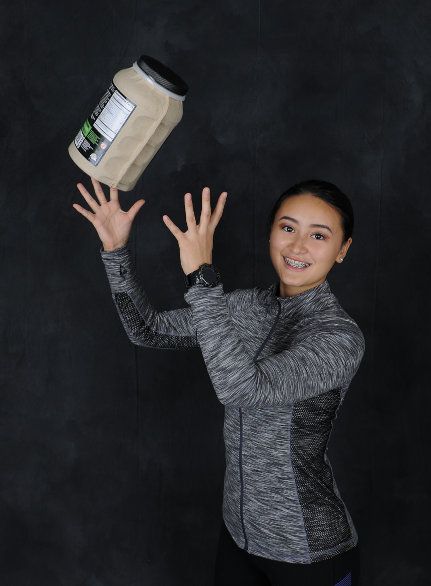 U.S. Air Force Airman 1st Class Yuyi Jiang, 86th Dental Squadron dental assistant technician, throws a container of supplements in the air during a photo shoot on Ramstein Air Base, Germany, Sept. 13, 2017. Operation Supplement Safety is a Department of Defense dietary supplement resource for the military community, leaders, healthcare providers, and DoD civilians. Operation Supplement Safety has an official published list of dietary supplement "ingredients" currently prohibited by the DoD, which service members can find on the OPSS website. (U.S. Air Force photo by Senior Airman Savannah L. Waters)