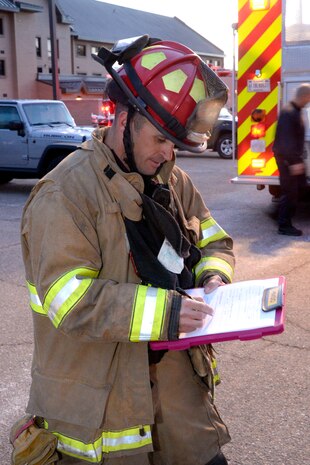 Fire Captain Jim Robinson, incident safety officer, reviews his checklist during an emergency response exercise Jan. 30, 2018, at Hill Air Force Base, Utah. (U.S. Air Force photo by Todd Cromar)