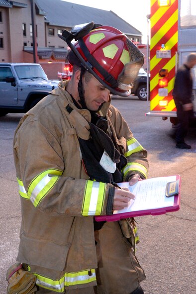 Fire Captain Jim Robinson, incident safety officer, reviews his checklist during an emergency response exercise Jan. 30, 2018, at Hill Air Force Base, Utah. (U.S. Air Force photo by Todd Cromar)