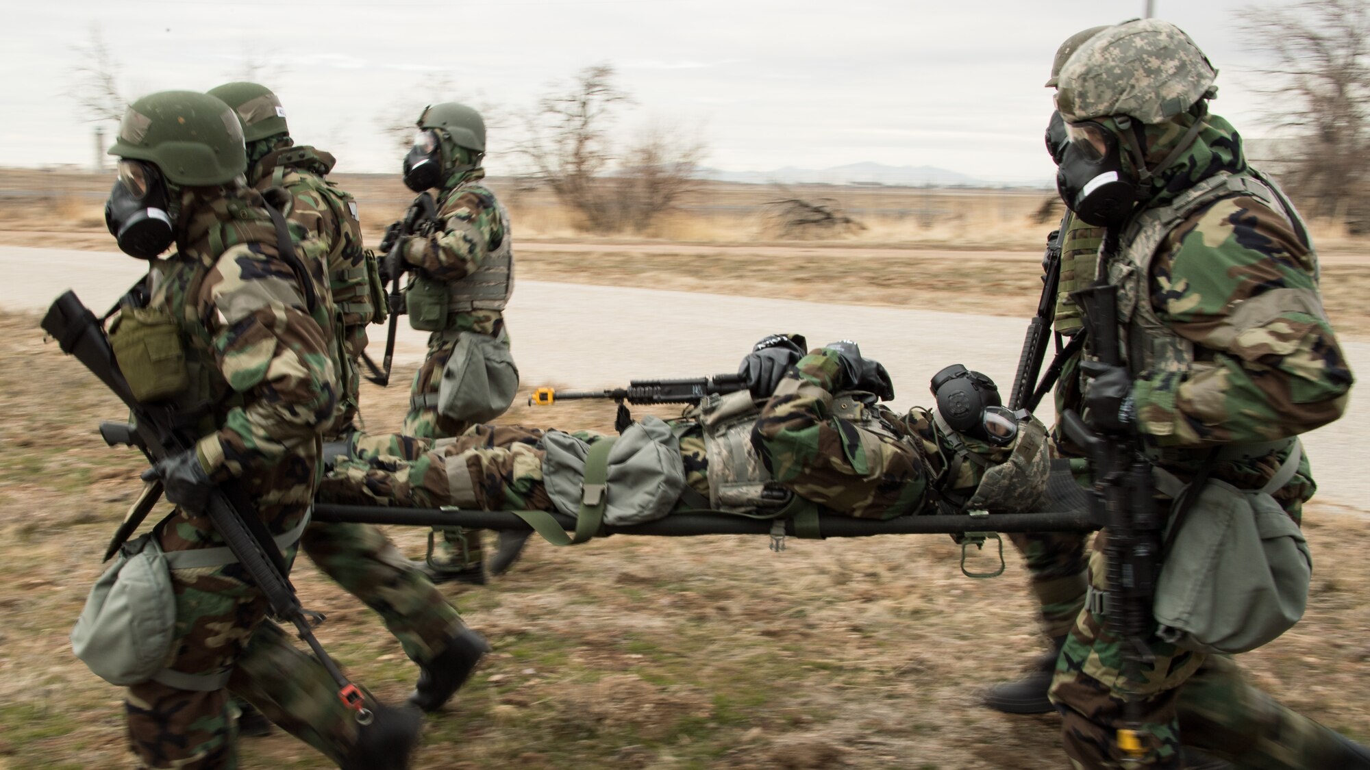 Airmen transport a simulated casualty on a litter during a readiness exercise Feb. 2, 2018, at Hill Air Force Base, Utah. (U.S. Air Force photo by R. Nial Bradshaw)