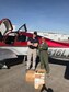 Maj. Bradford Ragan, Red Flag Tanker Task Force detachment commander and 349th Air Refueling Squadron assistant director of operations, and Rod Kallman, Cirrus flight instructor, pose for a photograph next to a chartered aircraft at a local airfield in North Las Vegas, Nevada, January 29, 2018.