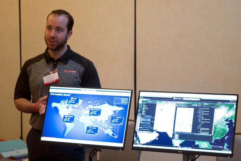 A technology company representative demonstrates network management solutions during the 2018 Luke Tech Expo at Luke Air Force Base, Ariz., Feb. 22, 2018. The tech expo invited all interested Luke Airmen to get a glimpse at new advances and future technology solutions. (U.S. Air Force photo/Senior Airman Ridge Shan)