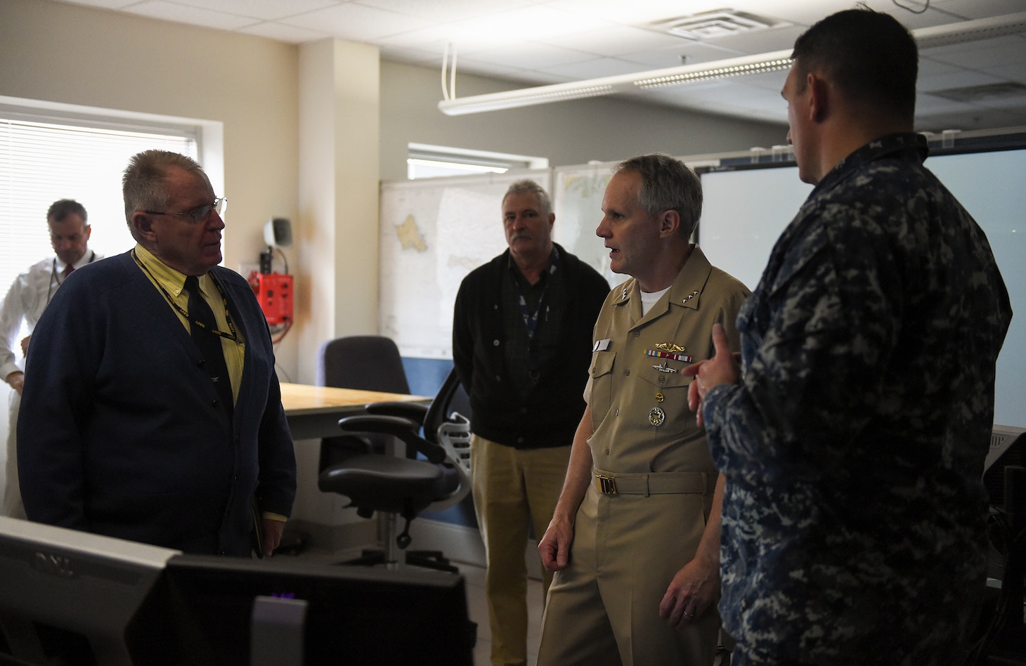 NEWPORT, R.I. (Feb. 21, 2018) Vice Adm. Phil Sawyer, commander, U.S. 7th Fleet, talks with Bud Weeks (left), director, Surface Warfare Officers School's (SWOS) Navigation, Seamanship and Shiphandling and Capt. Scott Robertson (right), SWOS' commanding officer during a visit to the school. Sawyer’s purpose was to provide an overview of 7th Fleet readiness and to provide feedback on how training ties into ensuring safe and effective operations at sea.