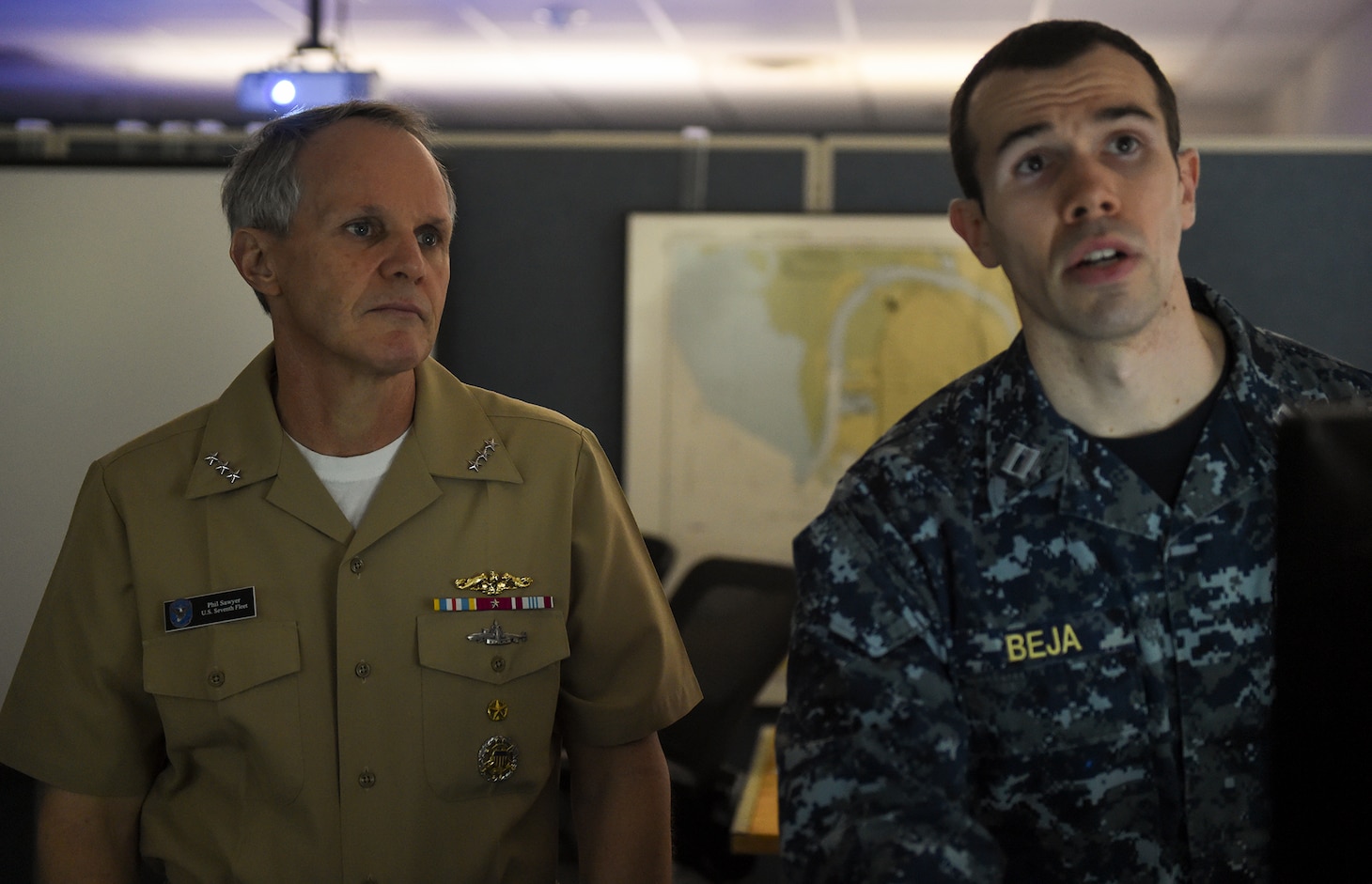 NEWPORT, R.I. (Feb. 21, 2018) Vice Adm. Phil Sawyer, commander, U.S. 7th Fleet, watches as Lt. James Beja, an instructor at Surface Warfare Officers School (SWOS), provides an overview of one of the training programs. Sawyer’s purpose was to provide an overview of 7th Fleet readiness and to provide feedback on how training ties into ensuring safe and effective operations at sea.