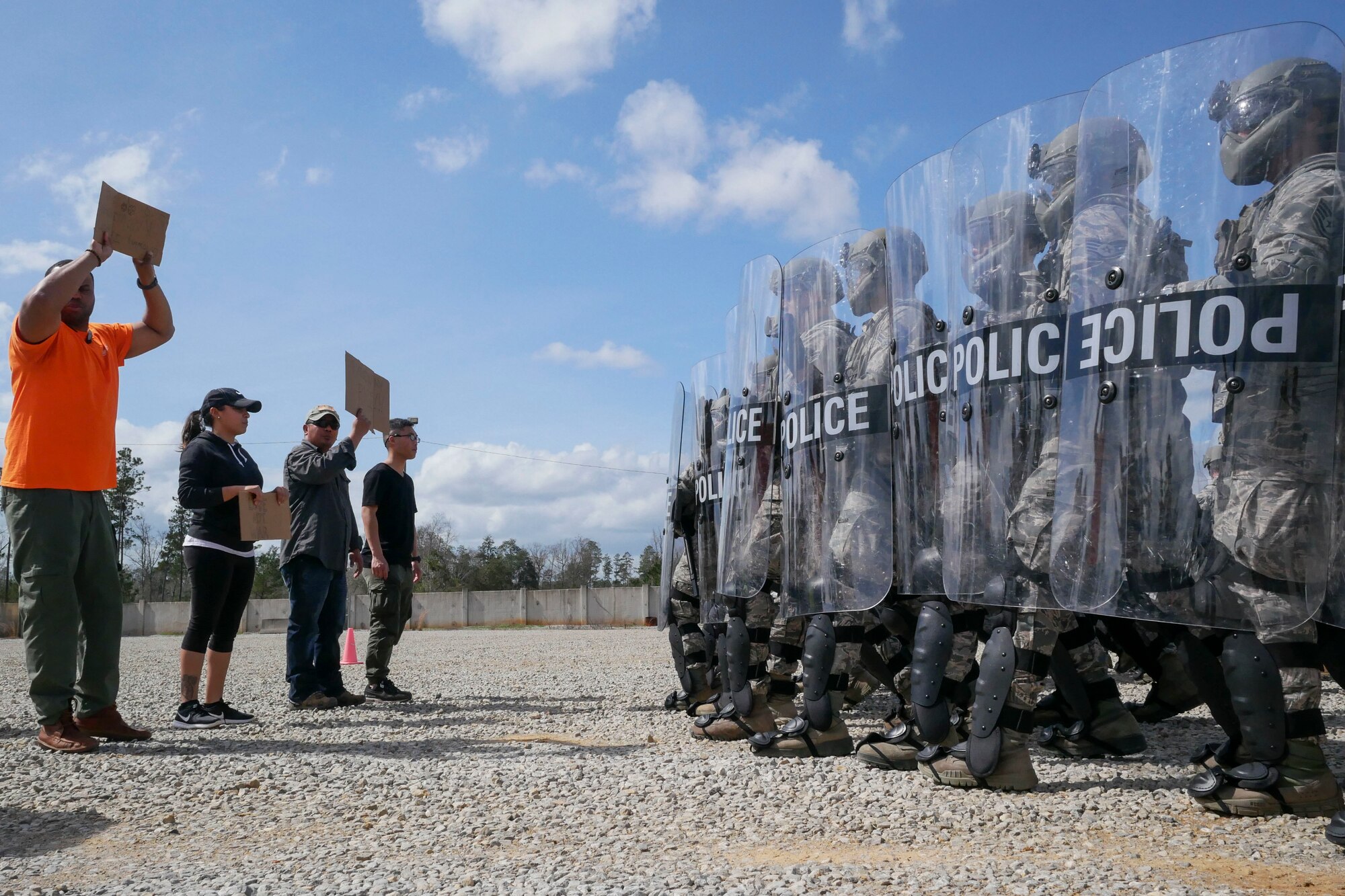 Defenders from the 154th Security Forces Squadron practice crowd control methods during exercise Patriot South Feb. 15, 2018, at Camp Shelby, Miss.