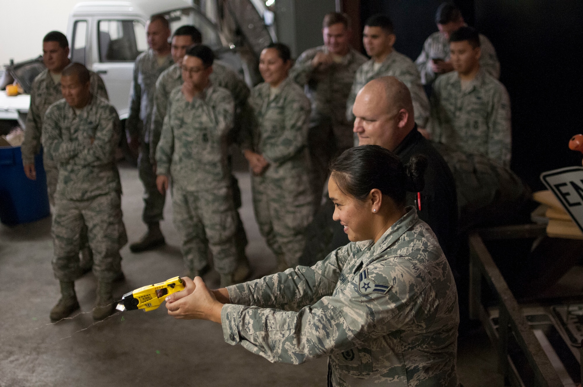 Airman 1st Class Anndora Haraguchi, 154th Security Forces Squadron fireteam member, fires a taser at a target as part of a taser-safety course Feb. 10, 2018, at Gulfport Combat Readiness Training Center, Mississippi.