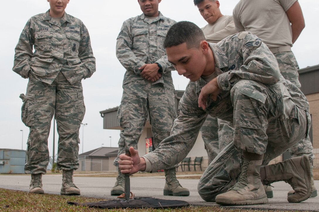 Senior Airman 1st Class Kaimipono Ramos, 154th Security Forces Squadron fireteam member, practices a thrust technique against a Kevlar vest Feb. 10, 2018, at Gulfport Combat Readiness Training Center, Mississippi.