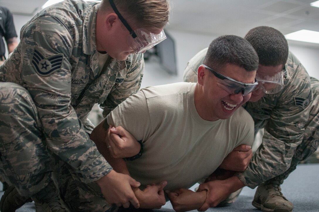 Airman 1st Class David Lovell, 154th Security Forces Squadron fireteam member, gets stunned during a taser certification course Feb. 10, 2018, at Gulfport Combat Readiness Training Center, Miss.