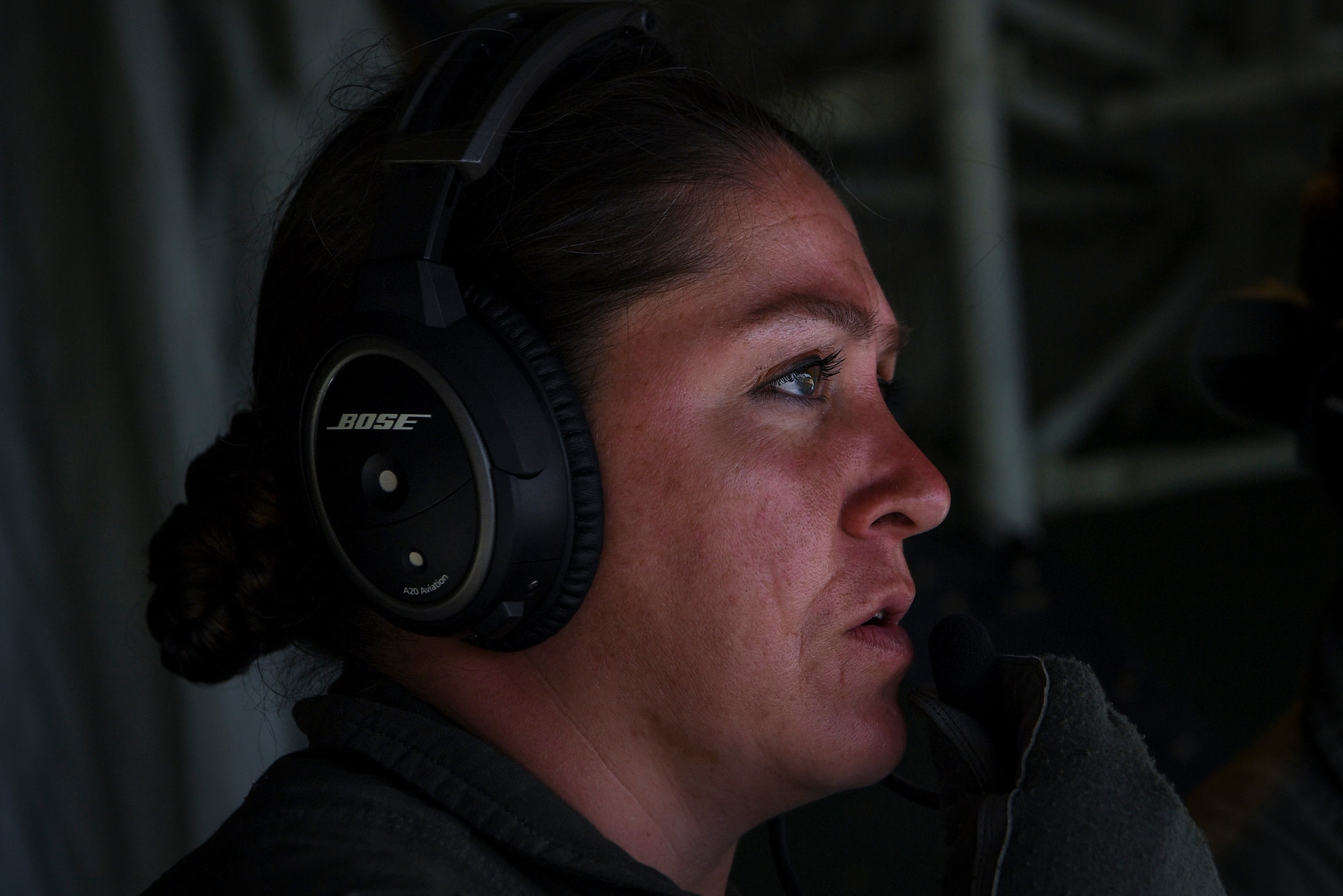 U.S. Air Force Major Catherine Paterson, 439th Aeromedical Evacuation Squadron medical crew director, talks on a communication system during an aeromedical mission at Tinian, U.S. Commonwealth of the Northern Mariana Islands, during exercise COPE NORTH 18, Feb. 19.