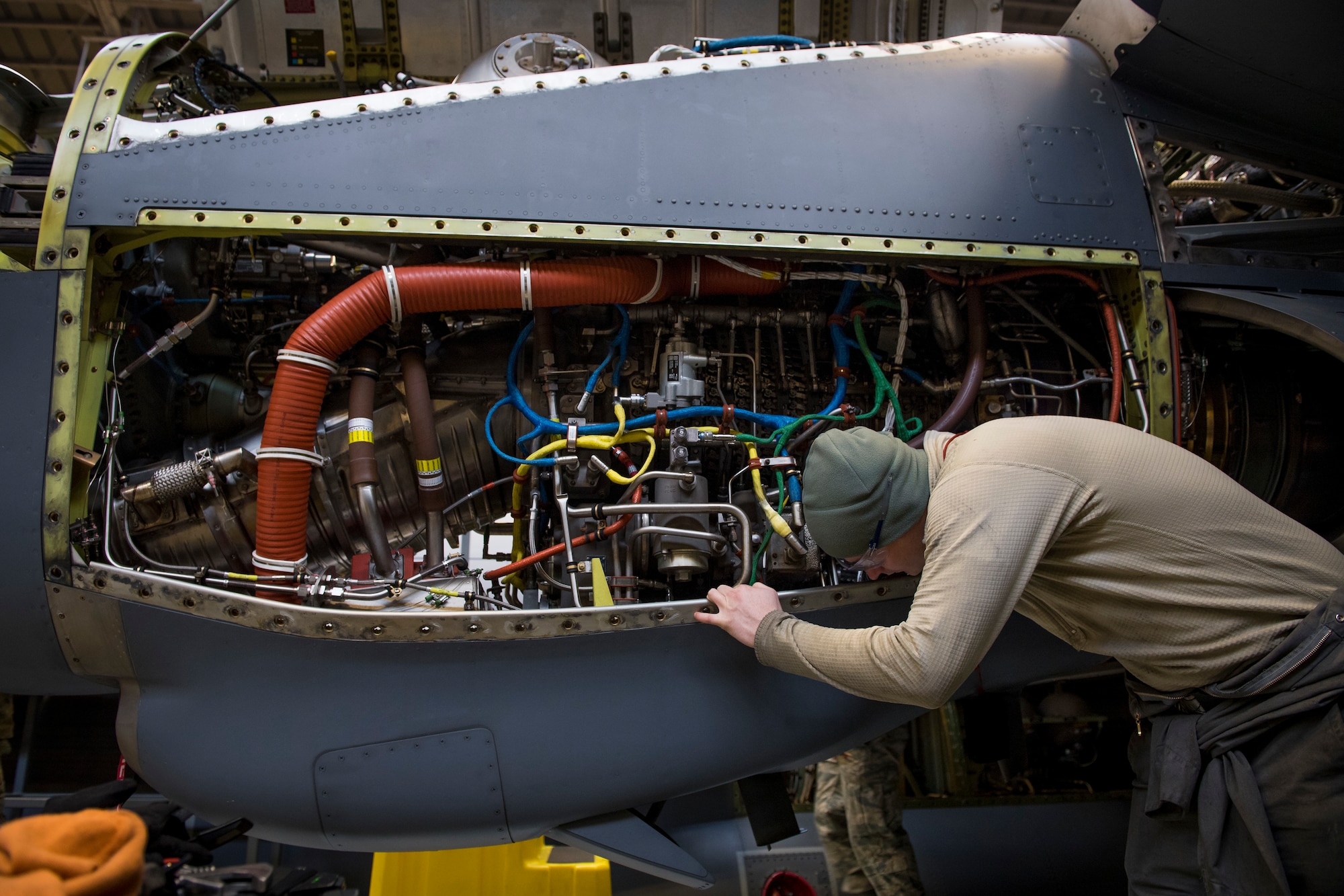 Senior Airman Dustin Owens, 374th Maintenance Squadron maintainer, installs a fire actuator on a C-130J Super Hercules’ Rolls Royce AE2100D3 engine, Feb. 22, 2018, at Yokota Air Base, Japan.
