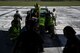 Reserve Airmen receive help from Royal Australian Air Force members with loading simulated patients onto a truck during an aeromedical mission at Saipan, U.S. Commonwealth of the Northern Mariana Islands, during exercise COPE NORTH 18, Feb. 19, 2018. COPE NORTH 18 is a Pacific Air Forces sponsored tri-lateral field training exercise designed to develop synergistic and increase interoperability of the U.S. Air Force, Royal Australian Air Force, and Koku Jieitai (Japan Air Self-Defense Force). (U.S. Air Force photo by Staff Sgt. Corey Hook)