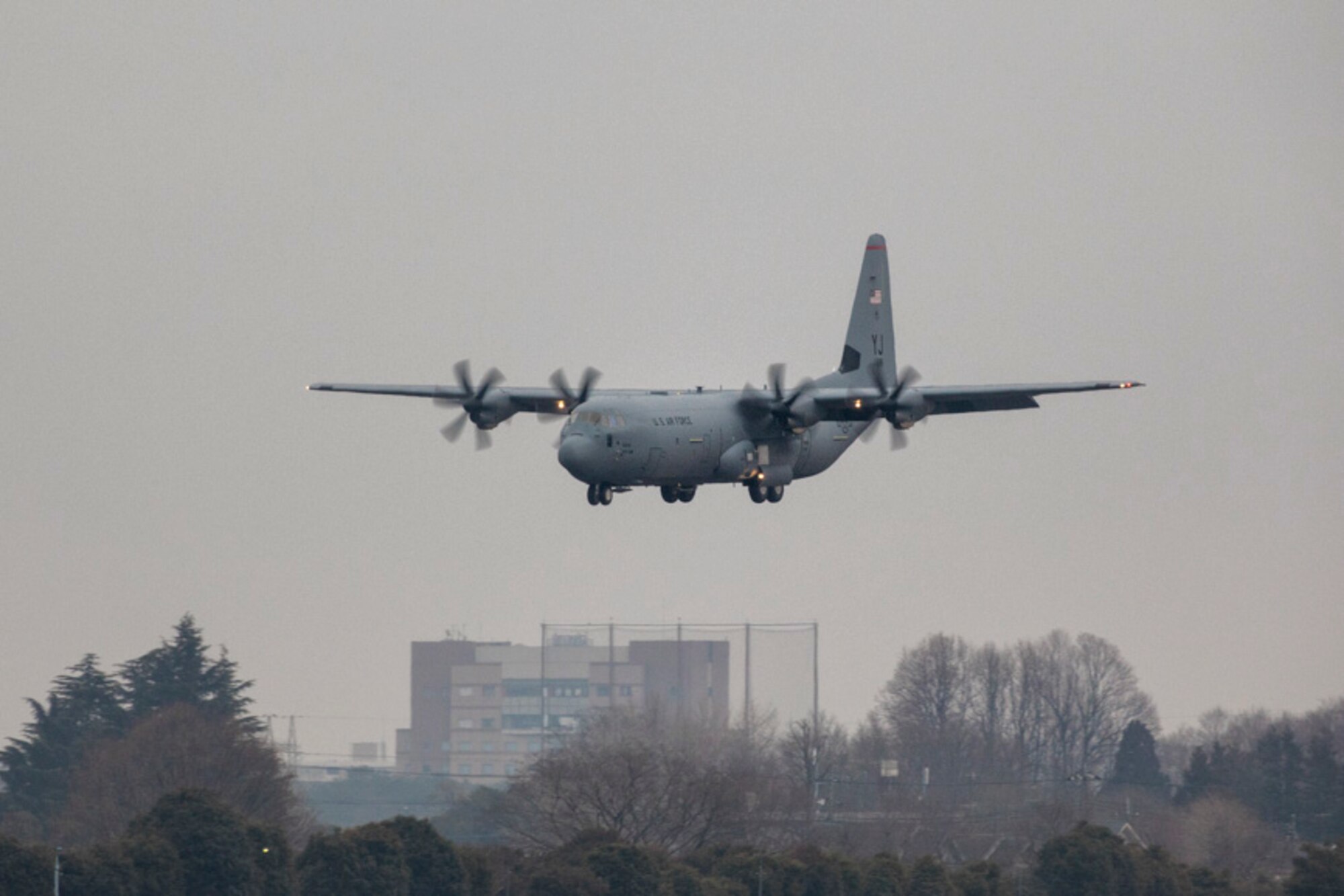 A C-130J Super Hercules approaches the runway at Yokota Air Base, Japan