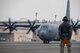 Airman Victor Trevino, 374th Aircraft Maintenance Squadron crew chief, waits to marshal