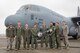 Members of the C-130J Super Hercules number 5838 delivery team pose for a photo