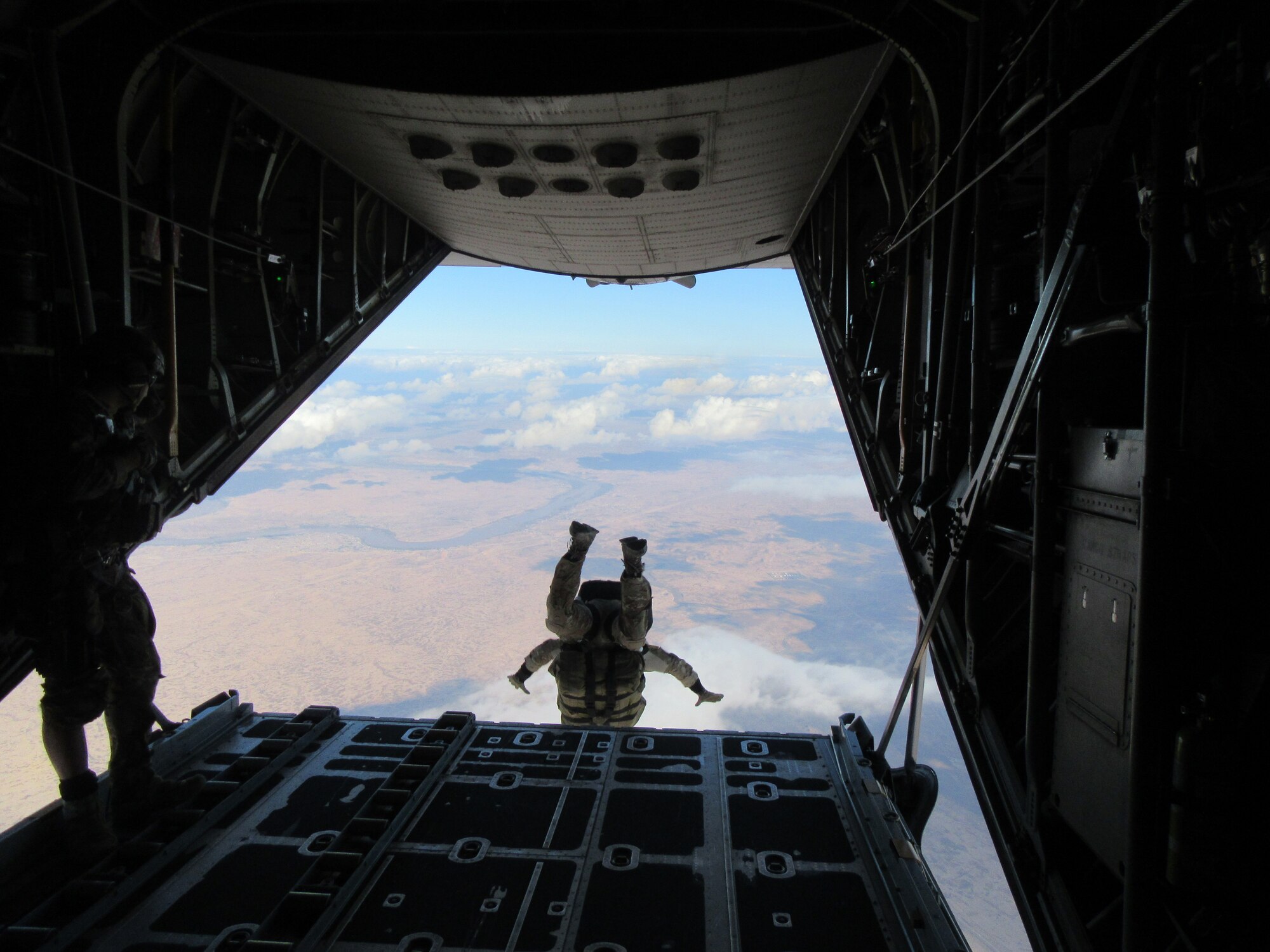 Members of the 1st Expeditionary Rescue Group conduct jump operations over an undisclosed location