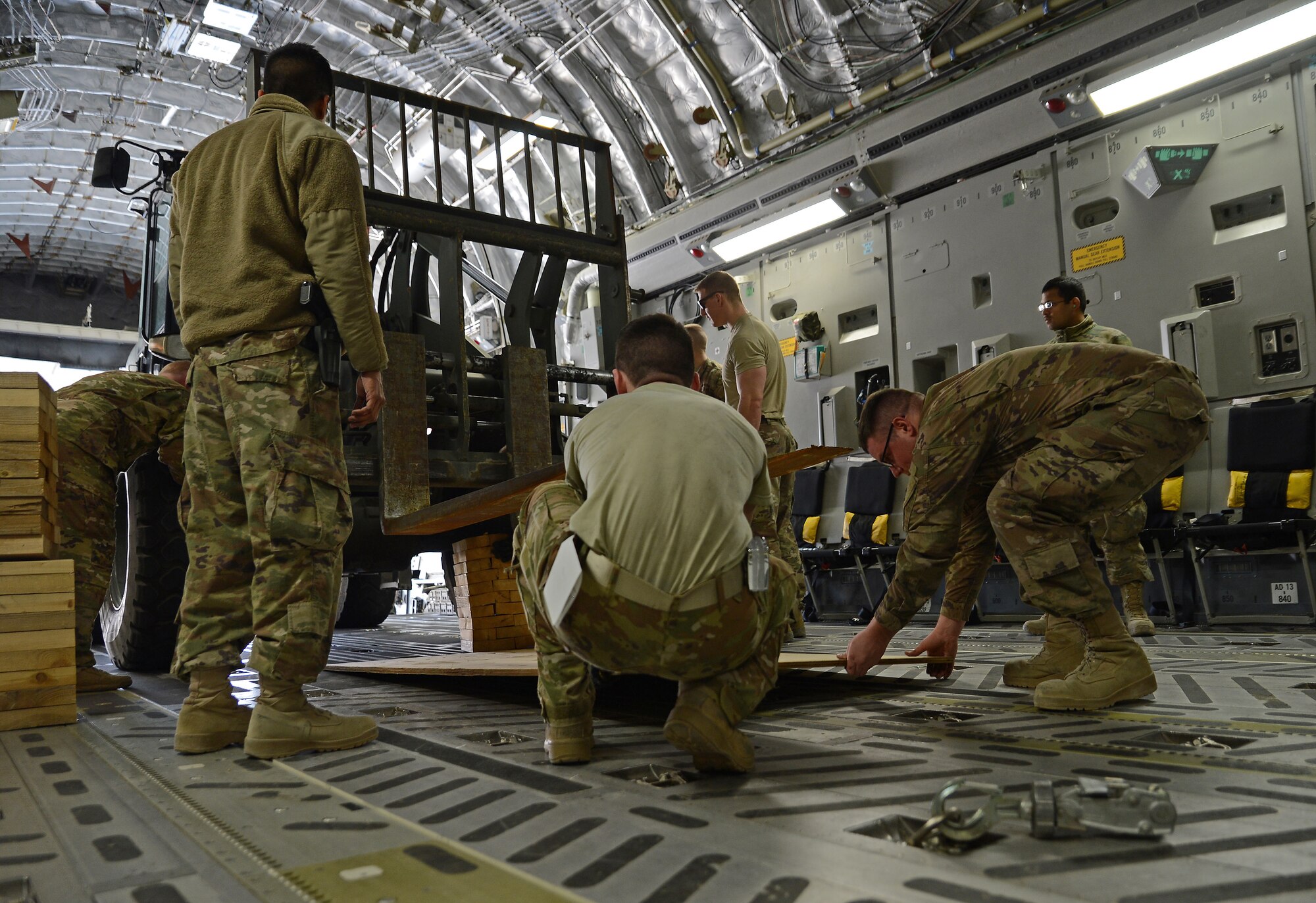 Airmen of the 455th Expeditionary Logistics Readiness Squadron Central Command material recovery element load a 10K All Terrain Forklift onto a C-17 Globemaster III Feb. 17, 2018 at Bagram Airfield, Afghanistan.