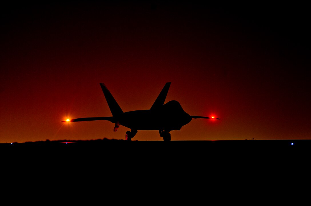 An U.S. Air Force F-22 Raptor assigned to the 380th Air Expeditionary Wing,  Al Dhafra Air Base, United Arab Emirates prepares to taxi down the runway in  support of Operation Inherent Reslove, Feb. 13, 2018. The Raptor is a critical component of the Global Strike Task Force and is designed to
 project air dominance, rapidly and at great distances and defeat threats  attempting to deny access to our nation's Air force, Army, Navy and Marine Corps. (U.S. Air Force photo by Tech. Sgt. Anthony Nelson Jr.)