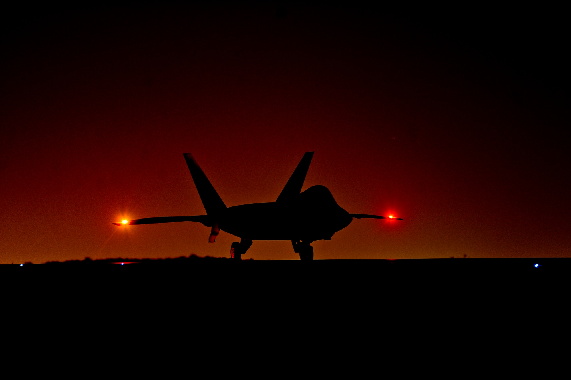 An U.S. Air Force F-22 Raptor assigned to the 380th Air Expeditionary Wing,  Al Dhafra Air Base, United Arab Emirates prepares to taxi down the runway in  support of Operation Inherent Reslove, Feb. 13, 2018. The Raptor is a critical component of the Global Strike Task Force and is designed to
 project air dominance, rapidly and at great distances and defeat threats  attempting to deny access to our nation's Air force, Army, Navy and Marine Corps. (U.S. Air Force photo by Tech. Sgt. Anthony Nelson Jr.)