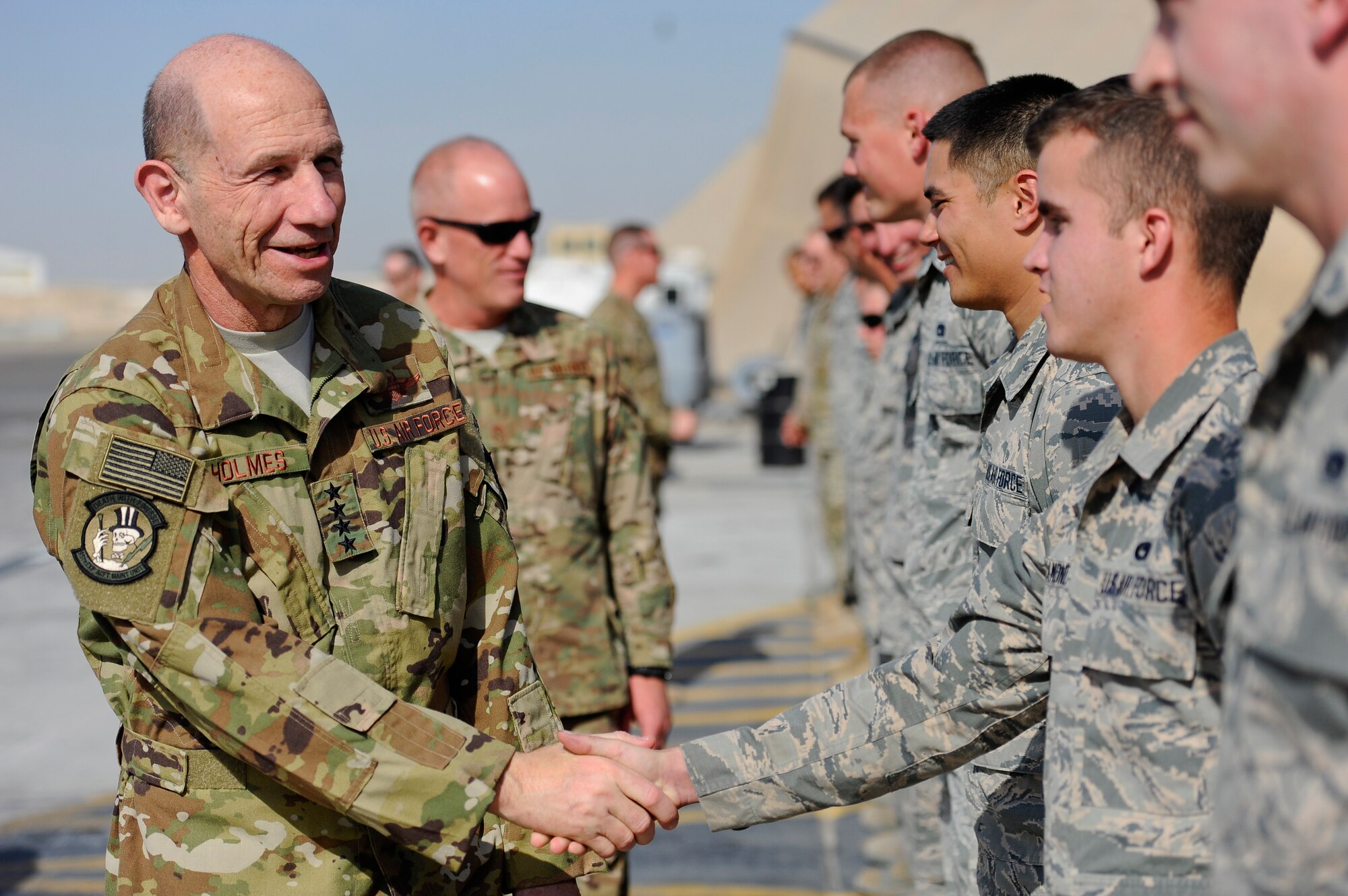 U.S. Air Force Gen. Mike Holmes, commander of Air Combat Command and Chief  Master Sgt. Frank Batten, command chief of Air Combat Command meet with Airmen assigned to the 380th Expeditionary Aircraft Maintenance Squadron, Feb. 11, 2018, on Al Dhafra Air Base, UAE. The 380th AEW is a forward-deployed group of professional Airmen charged with executing the AFCENT Commander's mission: Deliver decisive air power, Defend the region and Develop relationships.
 (U.S. Air Force photo by Tech. Sgt. Anthony Nelson J.R.)