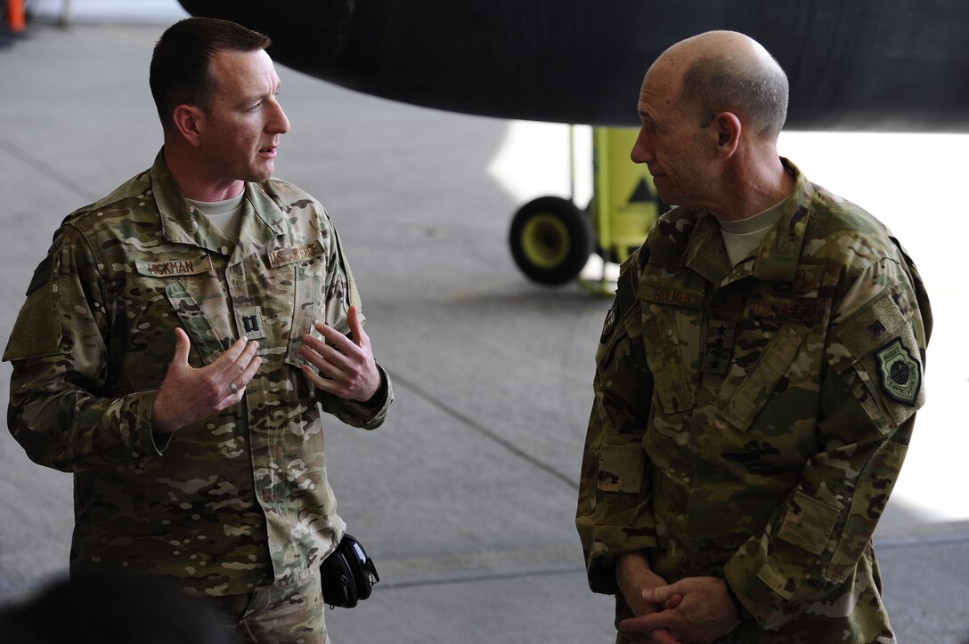 U.S. Air Force Capt. Christopher Hickman briefs Gen. Mike Holmes,  commander of Air Combat Command about the RQ-4's mission at the 380th Air  Expeditionary Wing, Al Dhafra Air Base, Feb. 11, 2018. The RQ-4 Global Hawk  is a high-altitude, long-endurance, remotely piloted aircraft with an  integrated sensor suite that provides global all-weather, day or night
 intelligence, surveillance and reconnaissance (ISR) capability. 
 (U.S. Air Force photo by Tech. Sgt. Anthony Nelson J.R.)