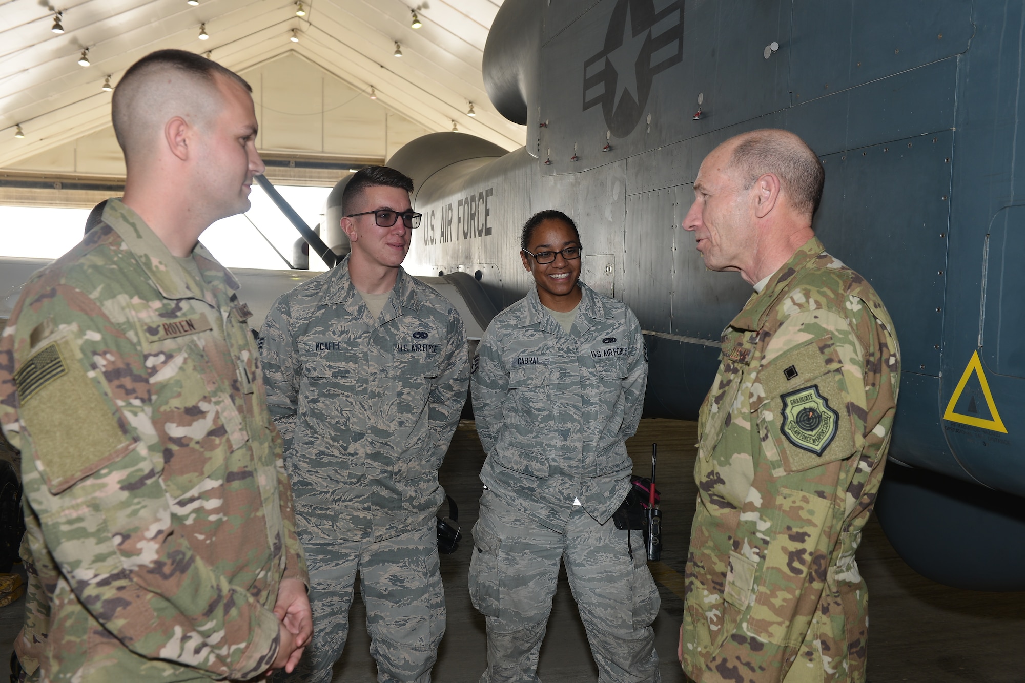 U.S. Air Force Gen. Mike Holmes, commander of Air Combat Command
 speaks with RQ-4 Global Hawk crew chiefs
 assigned to the 380th Expeditionary Aircraft Maintenance Squadron, Feb. 11,
 2018, on Al Dhafra Air Base, United Arab Emirates. The Global Hawk's mission
 is to provide a broad spectrum of ISR collection capability to support joint
 combatant forces in worldwide peacetime, contingency and wartime operations.
 (U.S. Air Force photo by Tech. Sgt. Anthony Nelson J.R.)