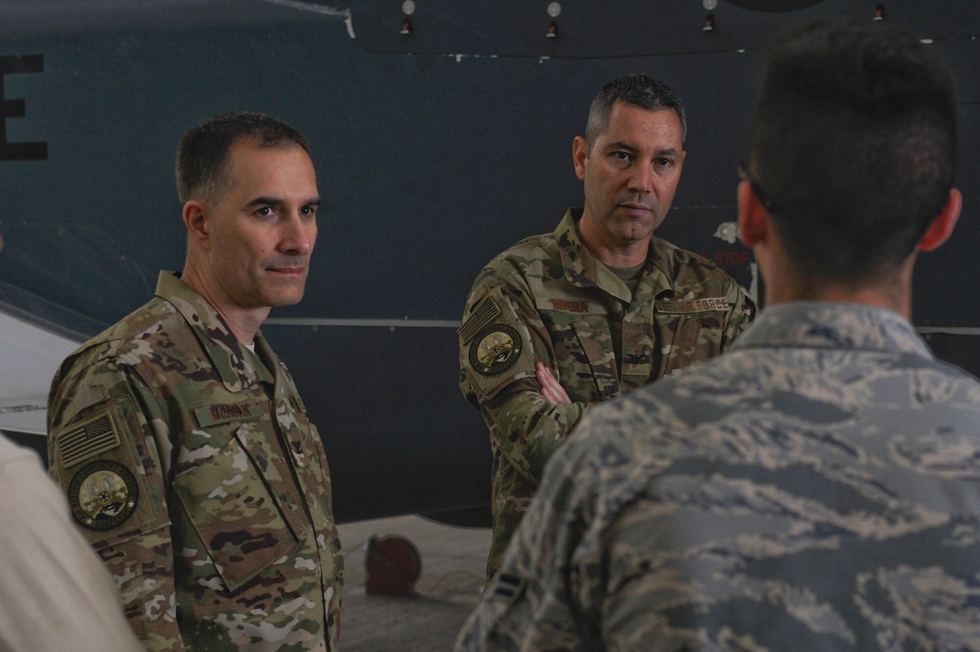 U.S. Air Force Col. Eric Rivera and Col. Troy Morgan, Air Forces Central Command air reserve component advisors, listen to a briefing on Al Dhafra Air Base, United Arab Emirates, Feb. 7, 2018. The ARC advisors traveled to ADAB in an effort to ease the transition between deployments for Air National Guardsmen and Air Force Reservists. (U.S. Air Force photo by Airman 1st Class D. Blake Browning)