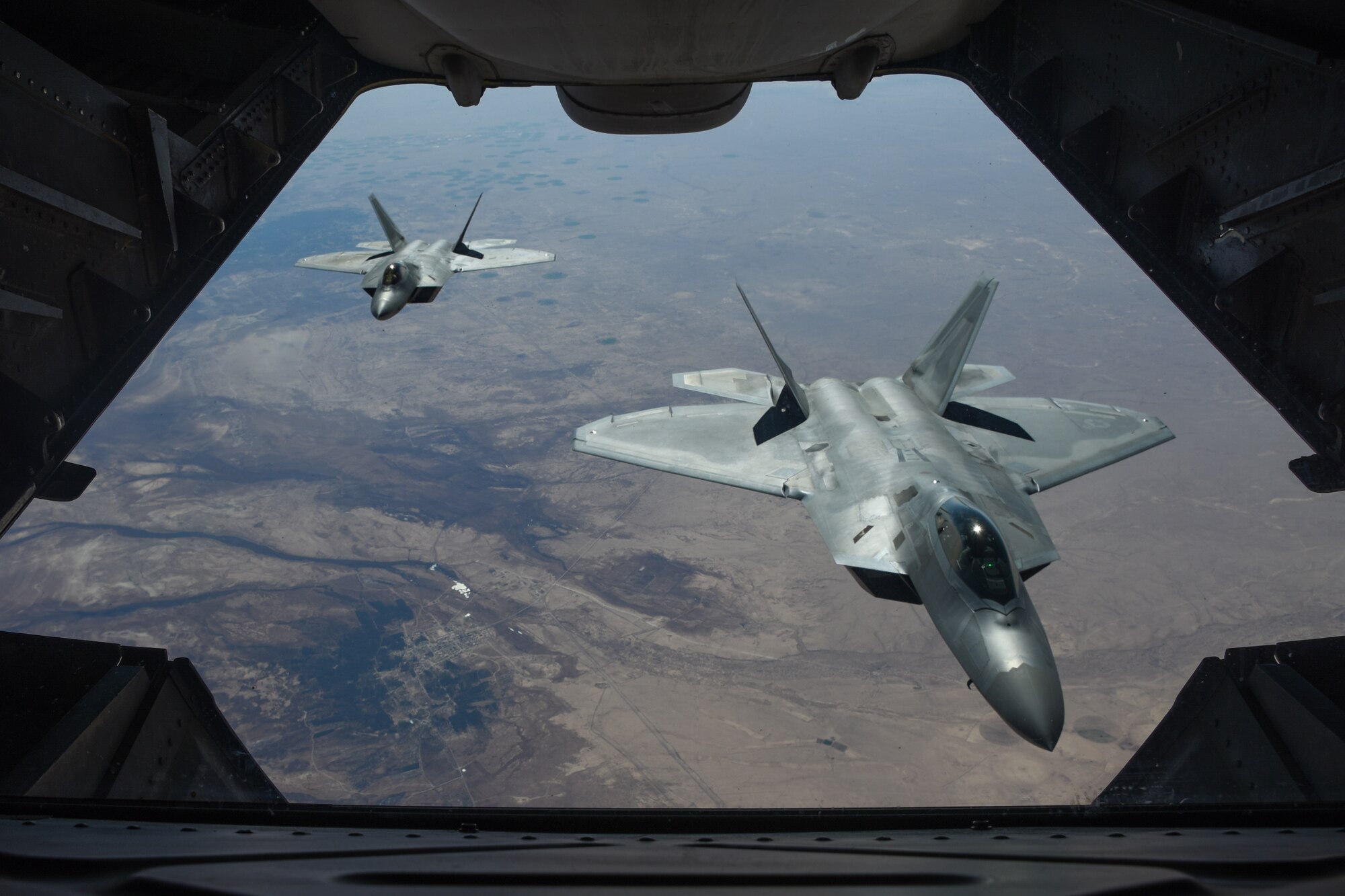 Two U.S. Air Force F-22 Raptors fly above Syria in support of Operation Inherent Resolve, Feb. 2, 2018. The F-22 is an air superiority fighter that incorporates the latest technological advances in reduced observables, avionics, engine performance and aerodynamic design. (U.S. Air National Guard photo by Staff Sgt. Colton Elliott)