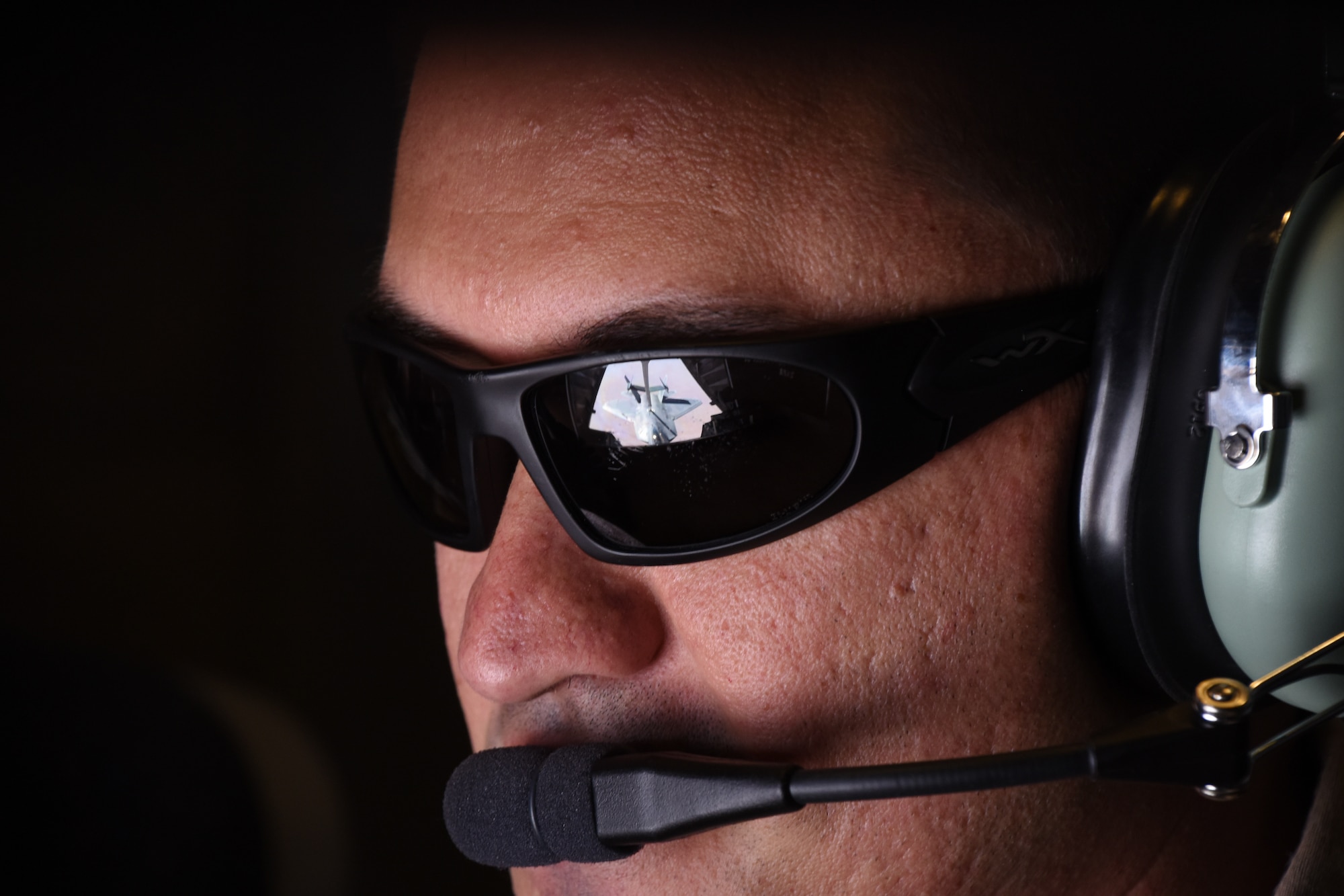 U.S. Air Force Staff Sgt. Abe Velasco, KC-10 Extender in-flight refueling operator, assigned to the 908th Expeditionary Refueling Squadron, refuels an U.S. Air Force F-22 Raptor during a mission in support of Operation Inherent Resolve over Syria, Feb. 2, 2018. The F-22 Raptor provides U.S. and Coalition forces with a tactical air strike and air superiority capability during combat missions in Iraq and Syria. (U.S. Air National Guard photo by Staff Sgt. Colton Elliott)