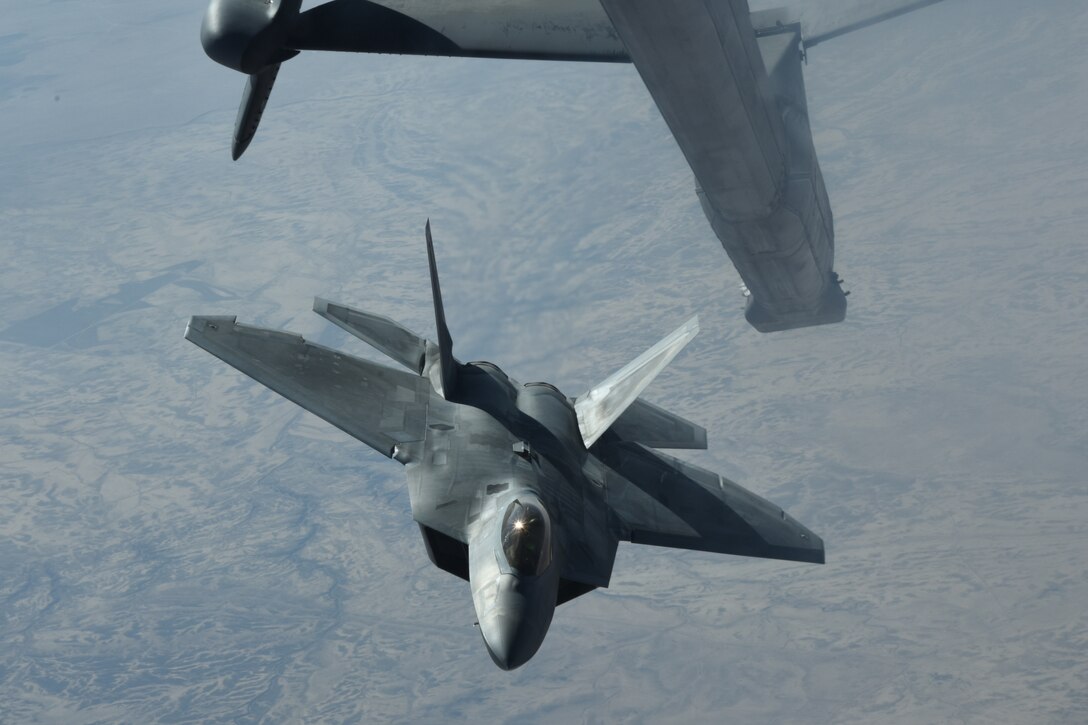 An U.S. Air Force F-22 Raptor departs after receiving fuel from a KC-10 Extender during a mission in support of Operation Inherent Resolve over Syria, Feb. 2, 2018. The F-22, a critical component of the Global Strike Task Force, is designed to project air dominance, rapidly and at great distances and defeat threats attempting to deny access to our nation's Air Force, Army, Navy and Marine Corps. (U.S. Air National Guard photo by Staff Sgt. Colton Elliott)