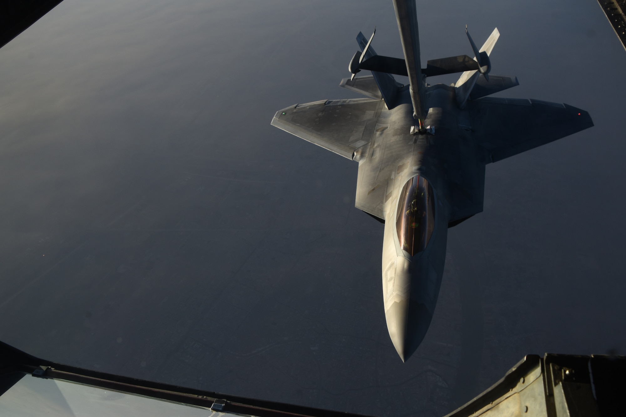 An U.S Air Force F-22 Raptor receives fuel from a KC-10 Extender during a mission in support of Operation Inherent Resolve over Iraq, Feb. 2, 2018. The F-22 is a component of the Global Strike Task Force, supporting U.S. and Coalition forces working to liberate territory and people under the control of ISIS. (U.S. Air National Guard photo by Staff Sgt. Colton Elliott)