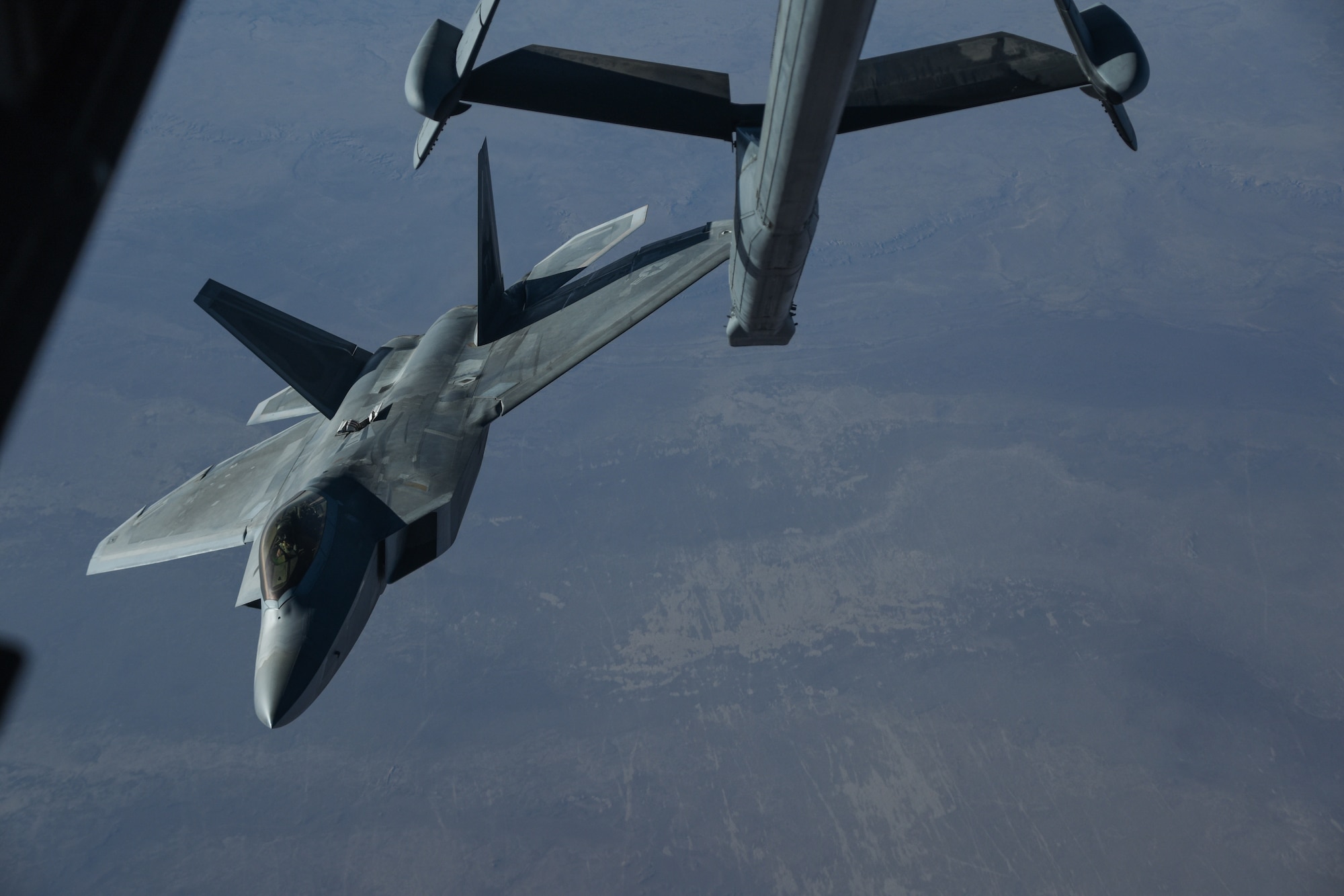 An U.S. Air Force F-22 Raptor departs after receiving fuel from a KC-10 Extender during a mission in support of Operation Inherent Resolve over Iraq, Feb. 2, 2018. The Raptor performs both air-to-air and air-to-ground missions allowing full realization of operational concepts vital to the 21st century Air Force. (U.S. Air National Guard photo by Staff Sgt. Colton Elliott)