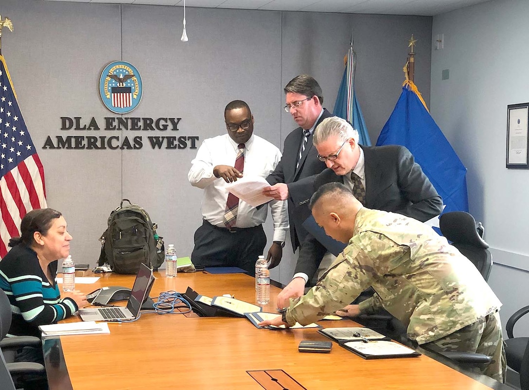 DLA Energy Americas at San Pedro Deputy Director John Phinisey, III, prepares for a meeting with his team.