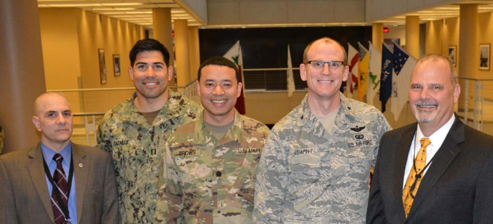 Army Lt. Col. Henry Brown (center) stands with DLA Energy Commander Air Force Brig. Gen. Martin Chapin and other Defense Logistics Agency Energy colleagues during the Joint Petroleum Seminar at DLA McNamara Headquarters Complex, Jan. 23.