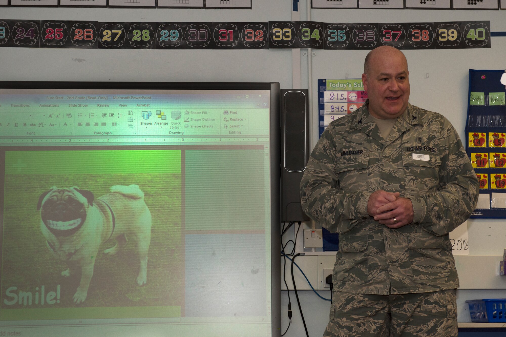 Col. Joseph A. Muhlbauer, the chief of dental professional staff assigned to the 48th Dental Squadron, prepares to give a presentation at Lakenheath Elementary School at Royal Air Force Lakenheath, England, Feb. 20, 2018. Muhlbauer presented an interactive, child-friendly slideshow about dental health in order to keep the young audience entertained. (U.S. Air Force photo/Airman 1st Class Shanice Williams-Jones)