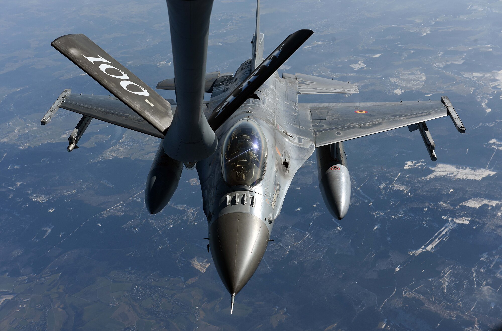 A Belgian Air Component F-16 flies behind a U.S. Air Force KC-135 Stratotanker from the 100th Air Refueling Wing, RAF Mildenhall, England, before receiving fuel over Germany, Feb. 23, 2018. The air refueling was part of a large force exercise with NATO allies including the Belgian, Dutch, French and German air forces.  (U.S. Air Force photo by Airman 1st Class Luke Milano)
