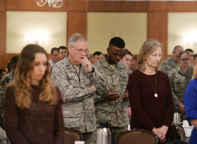 Team Offutt members pray during the National Prayer Breakfast held at the Patriot Club on Offutt Air Force Base, Nebraska, Feb. 15, 2018. The annual event is an opportunity for Department of Defense members, regardless of faith background, to come together and pray for our nation’s safety, prosperity, and freedom.