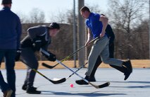 Members of Team Whiteman participate in the first extramural hockey practice at Whiteman Air Force Base, Mo., Feb. 17, 2018. Currently, the Whiteman Fitness Center does not have hockey listed as an intramural sport, but the members hope to raise enough interest to begin building teams within each squadron and host tournaments. (U.S. Air Force photo by Staff Sgt. Danielle Quilla)