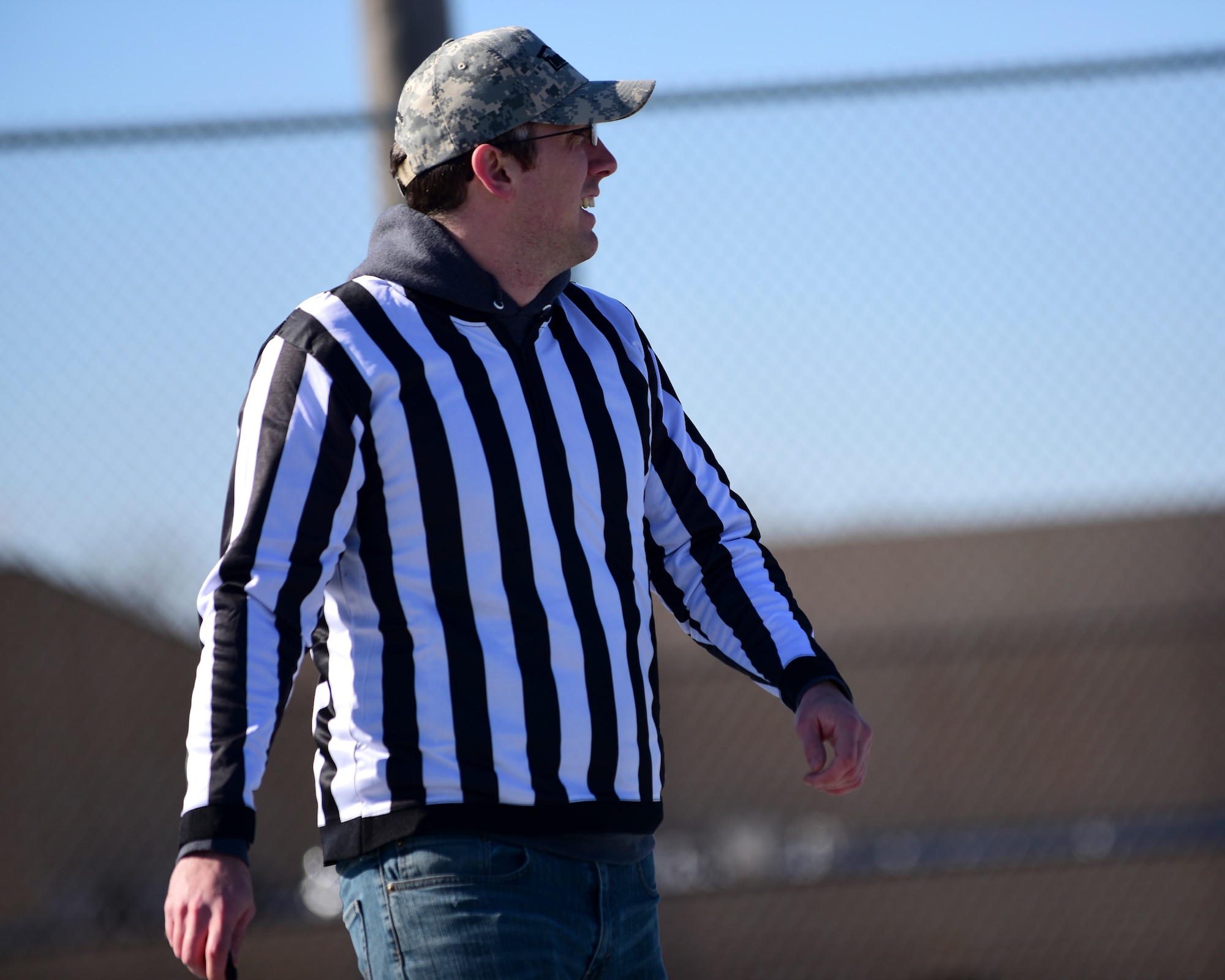 U.S. Air Force Senior Airman Wayne Haug, the extramural hockey referee from the 509th Munitions Squadron, watches members of Team Whiteman play hockey at Whiteman Air Force Base, Mo., Feb. 17, 2018. Haug is part of the team in charge of organizing the hockey events at Whiteman. (U.S. Air Force photo by Staff Sgt. Danielle Quilla)